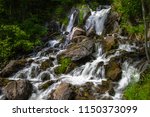 Upper Peninsula Michigan Roadside Waterfall. Beautiful Fumee Falls outside of Iron Mountain, Michigan is located at a roadside park along US 2 in the Upper Peninsula of Michigan.