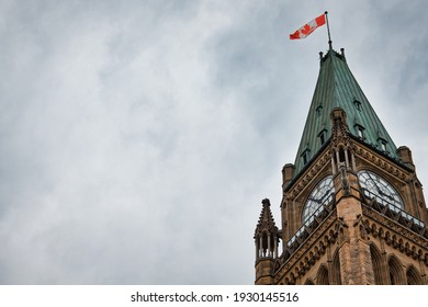 The upper portion of the Peace Tower on Parliament Hill in Ottawa, Canada from a low angle.