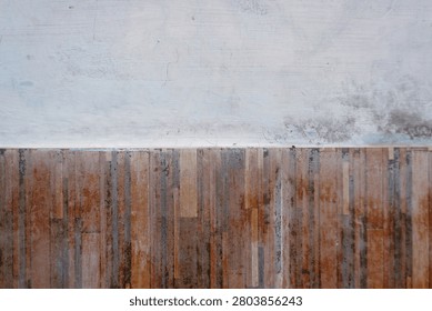 The upper section of the wall is starting to fade, while the lower section is tiled