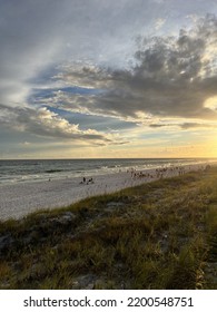 Upper Shoreline View Of Golden Sunset Skies On Florida White Sand Beach