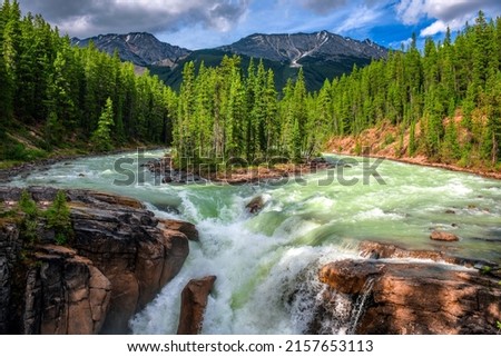 Upper Sunwapta Falls in Jasper National Park, Canada. The water originates from the Athabasca Glacier.