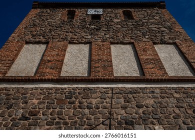 Upper tower section of historic fieldstone church in Lindenberg, Ahrensfelde, Marzahn, Germany