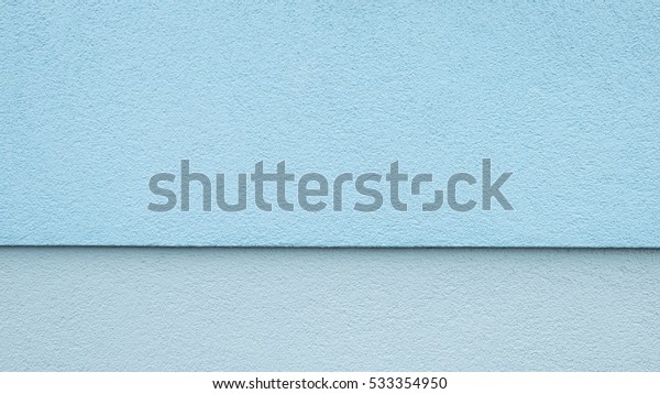 Upper two-thirds blue lower third light blue,\
horizontally divided wall