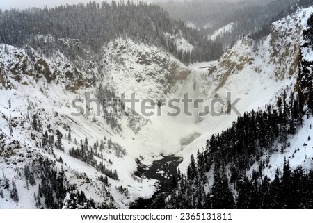 Upper Yellowstone Falls in Winter covered in heavy snow