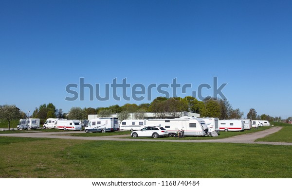 UPPSALA, SWEDEN ON MAY 10. View of caravans,\
campers and cars in Fyrishov camping on May 10, 2018 in Uppsala,\
Sweden. Lawn, road this side. Morning.\
