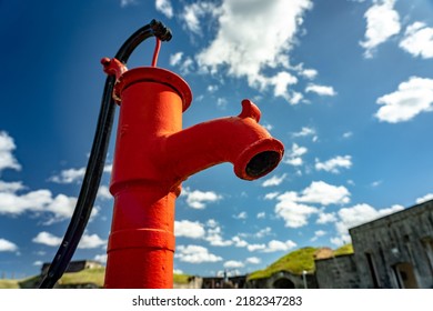 Upright Look At The Old Red Water Pump