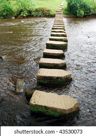 Upright View Of Stepping Stones Crossing River