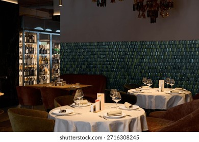 upscale bar environment characterized by soft lighting and elegant seating conducive to socializing