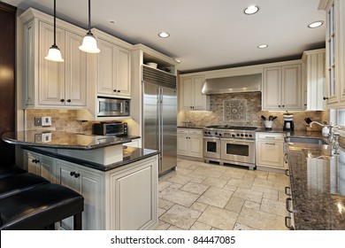 Upscale Kitchen In Luxury Home With Breakfast Bar