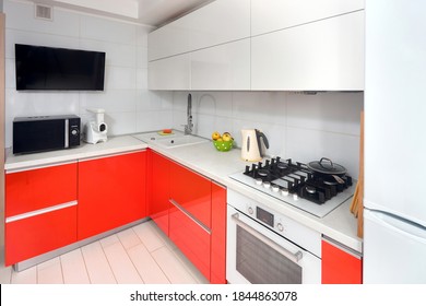 Upscale Maple Red And Smoky White Kitchen In Luxury Home With Stoneware Counter Top Flat Wooden Panels Design.