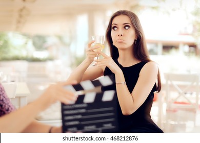 Upset Actress Holding a Glass in Movie Scene - Portrait of funny girl acting in a commercial 