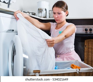 Upset Adult Woman Cannot Wash Stains Off White Shirt