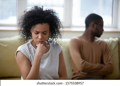 Upset African American Millennial Woman Feel Distressed Sit Separate After Fight With Biracial Husband, Sad Hurt Ethnic Couple Avoid Talking Think Of Breakup Or Divorce, Relationships Problems Concept