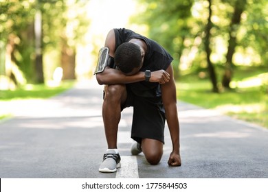 Upset African American Sportsman Standing On Park Path, Feeling Lost