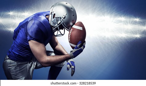 Upset American football player with ball against spotlights - Powered by Shutterstock