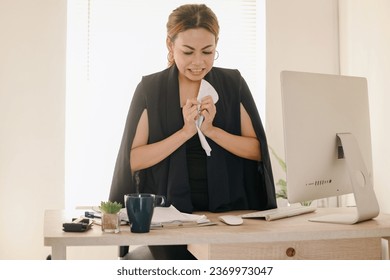 Upset Asian business woman crumpled paper with angry expression at the office - Shutterstock ID 2369973047
