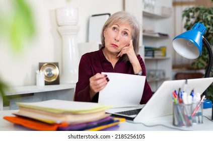 Upset Business Woman Reading Contract On Laptop Screen In Modern Office