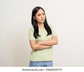 Upset confused bad emotional and thinking asian woman. Unhappy stressed female. Young latin lady standing feeling depressed dramatic scene looking copy space on isolated background. - Powered by Shutterstock