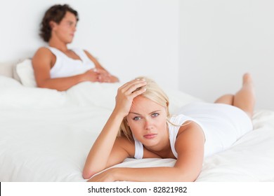 Upset Couple After An Argument On Their Bed