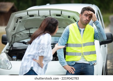 Upset Couple Arguing After Car Crash