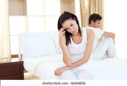 Upset couple finding out results of a pregnancy test in the bedroom - Powered by Shutterstock