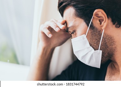 Upset Depressed Melancholy Sad Crying Man In Protective Face Mask With Crying During Serious Illness, Coronavirus Outbreak And Flu Covid19 Epidemic. Patient Guy Stay At Hospital, Get Stress, Lonely 