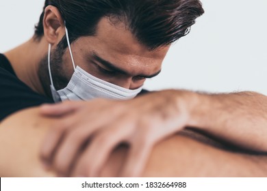 Upset depressed melancholy sad crying man in protective face mask with crying during quarantine, coronavirus outbreak and flu covid19 epidemic. Patient guy stay at quarantine room get stress, lonely 