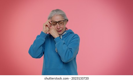 Upset Disappointed Senior Old Granny Gray-haired Woman Wipes Tears And Cries From Despair, Being Sad Because Of Unfair Things. People Lifestyle Emotions. Elderly Grandmother Pensioner Studio Shot