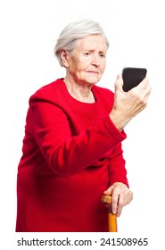 Upset Elderly Woman Using Touch Screen Mobile For Taking Selfie Or Making Video Call