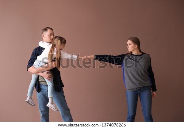 Upset\
family after divorce against color\
background