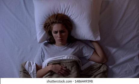 Upset Female Awakening In Bed, Disappointed With Bad Dream, Suffering Nightmares