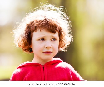 Upset Five Year Old Girl In The Summer Park