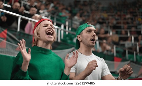 Upset football fans fail bet. Unhappy people loss goal. Sad person disappoint soccer game. Frustrated girl view match play close up. Annoyed guy cheer sport stadium. Bad day emotion. Man swear team. - Shutterstock ID 2261299485