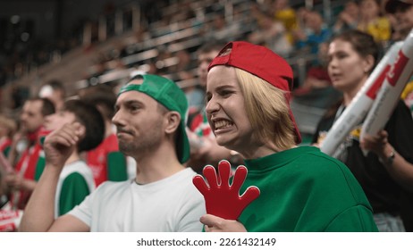 Upset football fans fail bet. Unhappy people loss goal. Sad person disappoint soccer game. Frustrated girl view match play close up. Annoyed guy cheer sport stadium. Bad day emotion. Man swear team. - Powered by Shutterstock