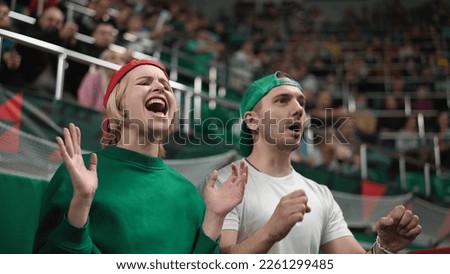 Upset football fans fail bet. Unhappy people loss goal. Sad person disappoint soccer game. Frustrated girl view match play close up. Annoyed guy cheer sport stadium. Bad day emotion. Man swear team.