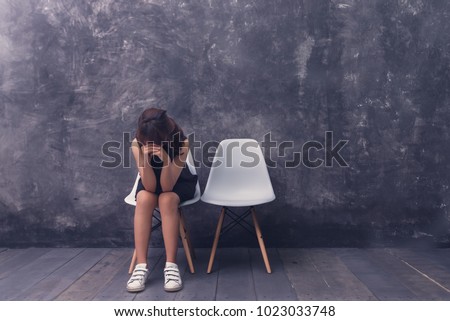 Upset Girl is heartbroken , lonely girl  sit on white chair And empty seats next to each other, 