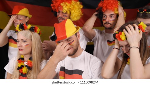 Upset Group Of Fans People Or German Supporters Looking Sad After Football Team Failure In International Sport Event