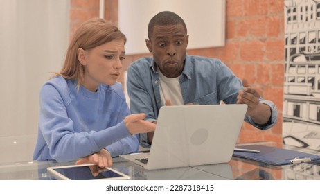 Upset Interracial Couple Arguing while Using Laptop, Angry Husband - Powered by Shutterstock