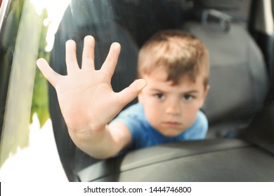 Upset Little Boy Closed Inside Car, Closeup With Space For Text. Child In Danger