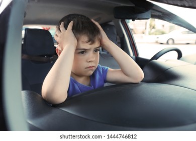 Upset Little Boy Closed Inside Car. Child In Danger