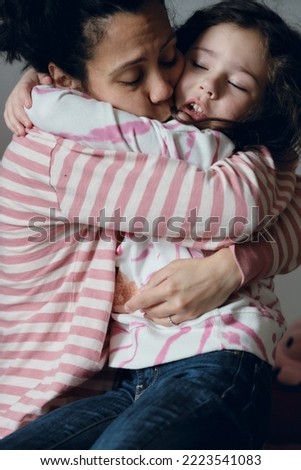 Similar – Newborn baby girl sleeping lying on blanket with her mother