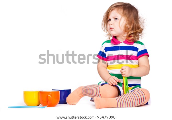 little girl play dishes