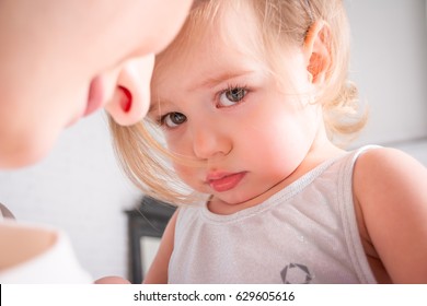 Upset little girl. Sad Small child.Sad child looking in camera.she wants hugging her mother - Shutterstock ID 629605616
