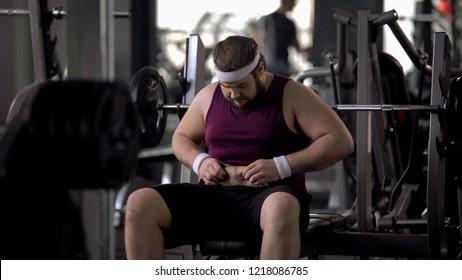 Upset Man Looking At His Fat Stomach, Desire To Lose Weight, Sport Gym Workout