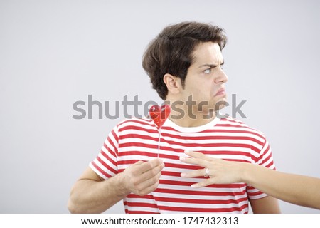 Similar – Image, Stock Photo Two red heart lollipop pattern on pink background