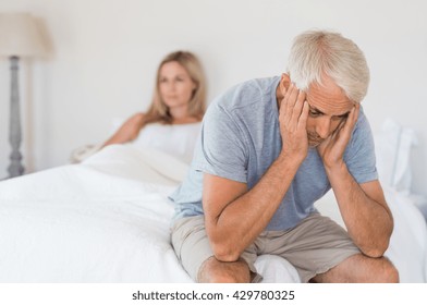 Upset Mature Couple Ignoring Each Other. Close Up Of A Worried Senior Man In Tension At Bed. Senior Couple Angry With Each Other After A Fight. 