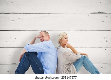 Upset Mature Couple Not Talking Against White Wood