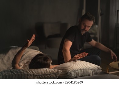 Upset Mid Adult Woman With Her Husband In Bed Arguing, Relationship Problems Concept.