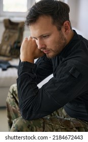 Upset Military Man Sitting At Home In Thoughts