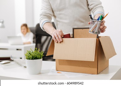 Upset Office Manager Packing The Box And Leaving The Office